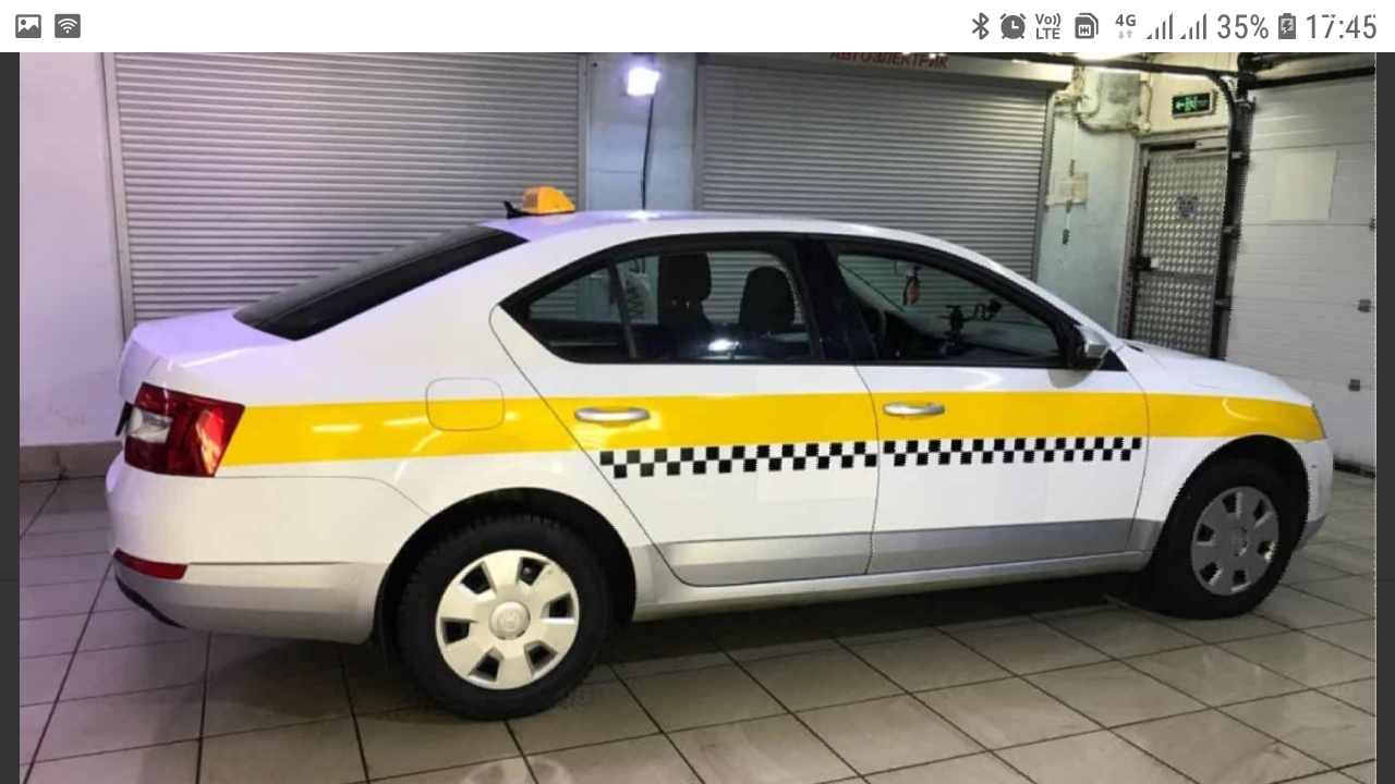 Аренда частных авто под такси. Машина Шкода Рапид 2021 такси. Шкода Рапид бело-желто-серый.
